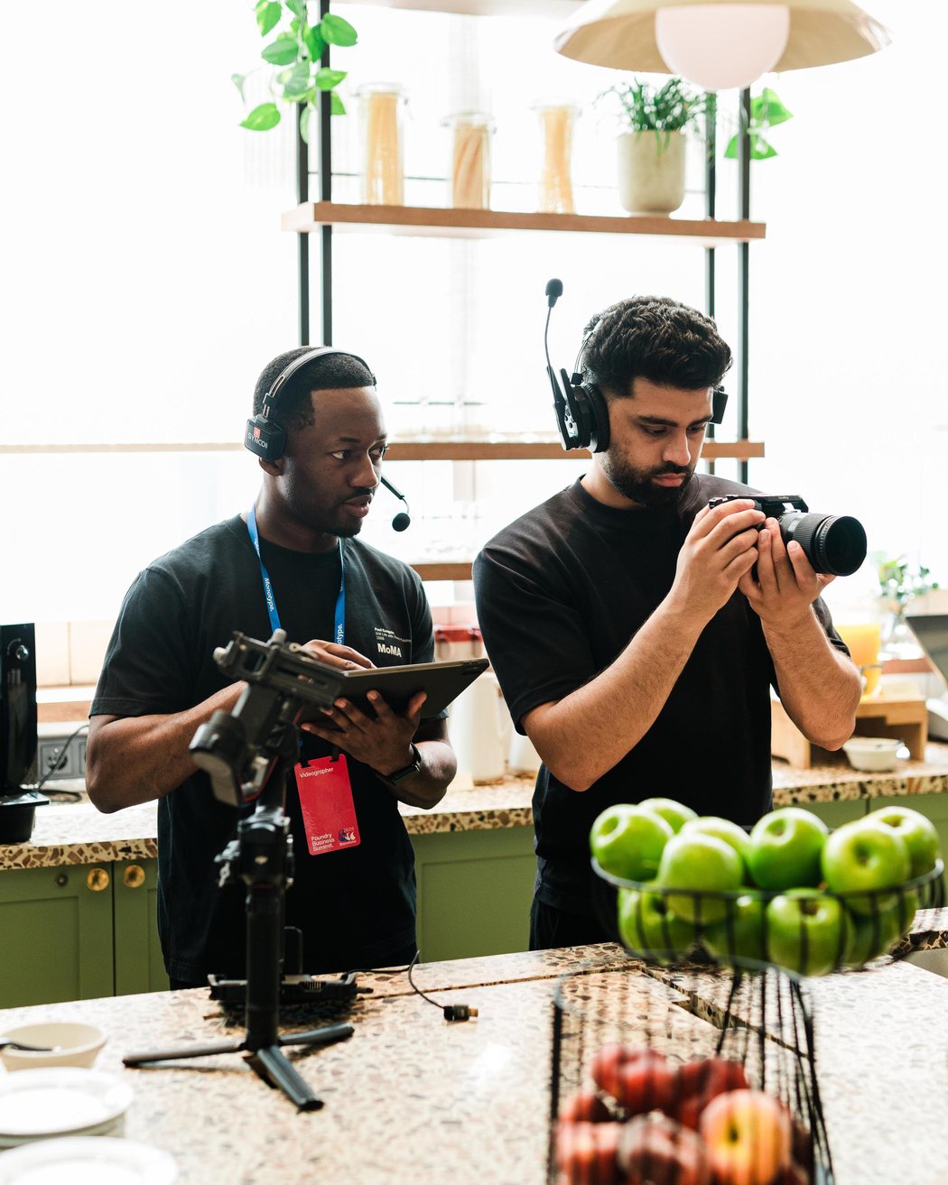 Tobi on set, monitoring a shoot with a second operator